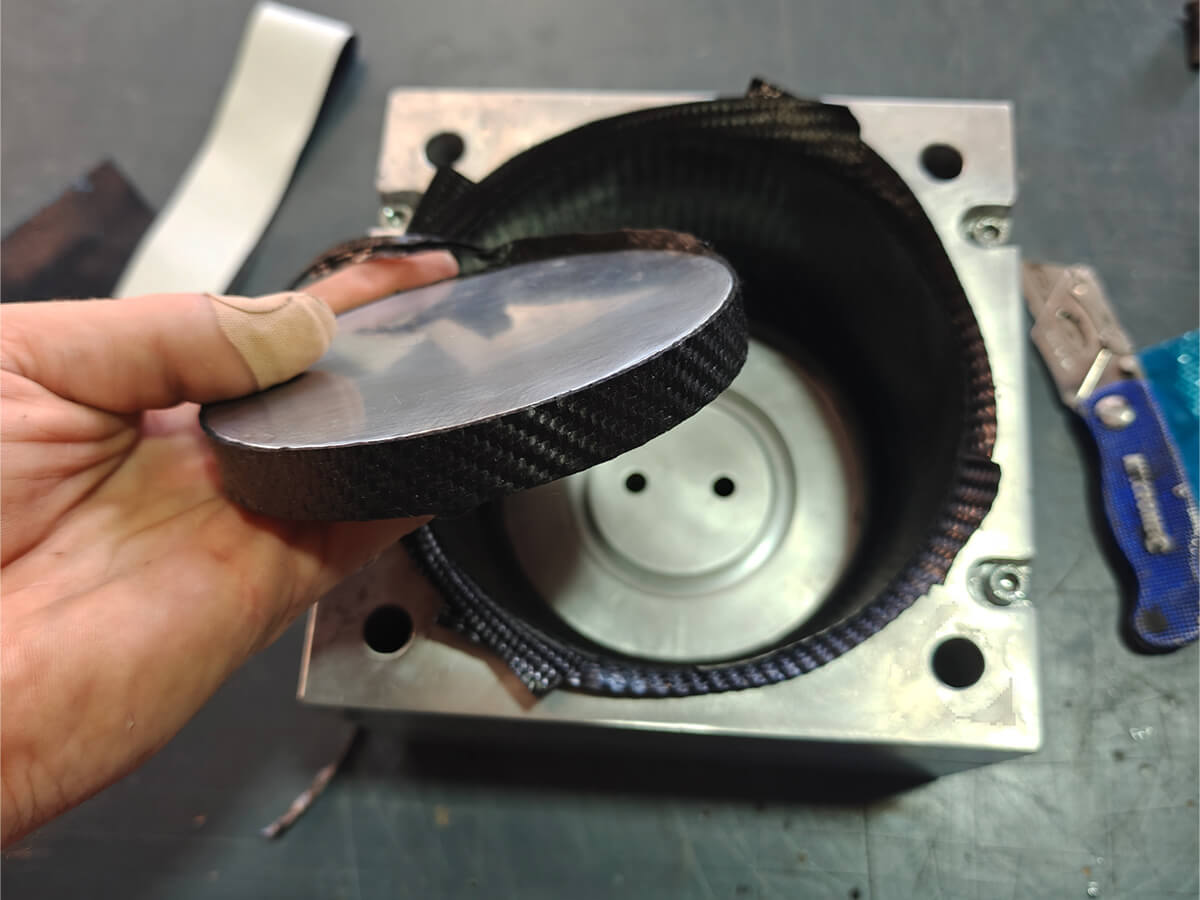 Aluminium puck seated in the tool